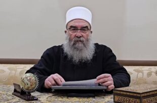 Hikmat al Hijri reading a speech in 2024